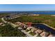 An aerial shot of a cozy home with waterfront views in a gated community near a large body of water at 13352 Creekside Ln, Port Charlotte, FL 33953