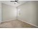 Neutral bedroom with a ceiling fan, tile flooring and a large window at 13352 Creekside Ln, Port Charlotte, FL 33953