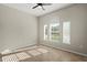 Neutral bedroom featuring a ceiling fan, a large window and tile flooring at 13352 Creekside Ln, Port Charlotte, FL 33953