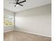 Neutral room showcasing tile floors, a ceiling fan, and a bright window at 13352 Creekside Ln, Port Charlotte, FL 33953