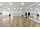 Bright dance studio with mirrors, wood floors, and ample space for fitness and dance activities at 13352 Creekside Ln, Port Charlotte, FL 33953