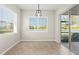 Dining room with waterfront views, tile floors, and natural light at 13352 Creekside Ln, Port Charlotte, FL 33953