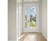 Bright foyer with tile flooring and a decorative glass front door at 13352 Creekside Ln, Port Charlotte, FL 33953
