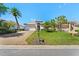 Beautiful home featuring a well-manicured lawn, brick driveway and mature palm trees in desirable community at 13352 Creekside Ln, Port Charlotte, FL 33953