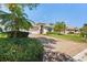Charming home with mature palms, a well-kept lawn, and a brick driveway at 13352 Creekside Ln, Port Charlotte, FL 33953