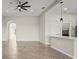 Bright, open living space with tiled floors and a ceiling fan at 13352 Creekside Ln, Port Charlotte, FL 33953