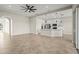 Open living area featuring tiled floors and views into the kitchen and outdoor areas at 13352 Creekside Ln, Port Charlotte, FL 33953