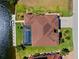 Aerial view of a waterfront property with a private boat dock and screened pool at 1341 Pine Siskin Dr, Punta Gorda, FL 33950