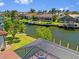 Home situated along a canal with boat docks, lifts, and boat access at 1341 Pine Siskin Dr, Punta Gorda, FL 33950