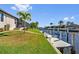 Waterfront property with a concrete dock and boat lift along the canal at 1341 Pine Siskin Dr, Punta Gorda, FL 33950