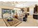 Open-concept living space featuring tile flooring, modern furniture, and access to the outdoor area at 1341 Pine Siskin Dr, Punta Gorda, FL 33950