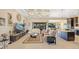 Open-concept living room and kitchen with tile flooring and ample seating at 1341 Pine Siskin Dr, Punta Gorda, FL 33950