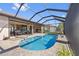 Inviting pool area with an outdoor kitchen and ample space for entertaining guests at 1341 Pine Siskin Dr, Punta Gorda, FL 33950