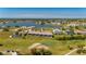 Stunning aerial view of a condo complex on the golf course with lake views at 1408 San Cristobal Ave # 4, Punta Gorda, FL 33983