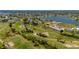 Aerial view featuring the condo surrounded by a golf course, sand traps and winding cart paths at 1408 San Cristobal Ave # 4, Punta Gorda, FL 33983