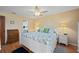 Bright bedroom with a king-size bed, light walls, and wood-look flooring at 1408 San Cristobal Ave # 4, Punta Gorda, FL 33983