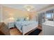 Bright bedroom with a king-size bed, light walls, and a ceiling fan at 1408 San Cristobal Ave # 4, Punta Gorda, FL 33983