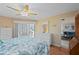 Bright bedroom with a king-size bed, light walls, and shutter doors to the lanai at 1408 San Cristobal Ave # 4, Punta Gorda, FL 33983