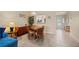 Light-filled dining area complemented by a plant and a large window framing the kitchen at 1408 San Cristobal Ave # 4, Punta Gorda, FL 33983