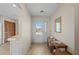 Light-filled entryway featuring tile floors, hall table, and exterior views at 1408 San Cristobal Ave # 4, Punta Gorda, FL 33983