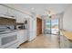 An updated kitchen with a view of the water, featuring modern appliances and tile flooring at 1408 San Cristobal Ave # 4, Punta Gorda, FL 33983