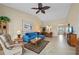 Inviting living room featuring sliding doors to the lanai and a dining area at 1408 San Cristobal Ave # 4, Punta Gorda, FL 33983