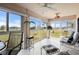 Enclosed sunroom with large windows showcasing scenic views and comfortable seating at 1408 San Cristobal Ave # 4, Punta Gorda, FL 33983