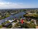 Aerial view of a waterfront home neighborhood with waterfront access to the ocean at 146 Francis Ne Dr, Port Charlotte, FL 33952