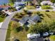 A high angle aerial shot of a home on a large lot featuring an inviting front lawn and double driveway at 146 Francis Ne Dr, Port Charlotte, FL 33952