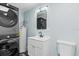 Well-lit bathroom with washer, dryer and updated vanity at 146 Francis Ne Dr, Port Charlotte, FL 33952