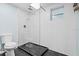 Renovated bathroom featuring a glass enclosed shower, modern fixtures and new tiling at 146 Francis Ne Dr, Port Charlotte, FL 33952