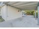 This carport offers ample space and tree coverage at 146 Francis Ne Dr, Port Charlotte, FL 33952