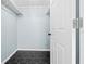 Walk-in closet featuring custom shelving and modern flooring at 146 Francis Ne Dr, Port Charlotte, FL 33952
