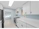 Bright kitchen with white cabinets, stone countertops, and a stainless steel range at 146 Francis Ne Dr, Port Charlotte, FL 33952