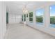 Bright sunroom with multiple windows, a chandelier, and built-in shelving at 146 Francis Ne Dr, Port Charlotte, FL 33952