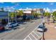 Lively commercial district with palm-lined streets, showcasing various shops, restaurants, and urban charm at 17094 Acapulco Rd # 312, Punta Gorda, FL 33955