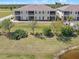 Beautiful two-story condo features a well-manicured lawn and screened-in patio at 17094 Acapulco Rd # 312, Punta Gorda, FL 33955