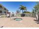 Community hot tub with nearby seating and mature landscaping at 17094 Acapulco Rd # 312, Punta Gorda, FL 33955