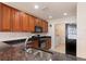 Well-equipped kitchen with stainless steel appliances and dark countertops at 17094 Acapulco Rd # 312, Punta Gorda, FL 33955
