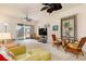 Spacious living room with sliding glass doors and tropical decor at 17094 Acapulco Rd # 312, Punta Gorda, FL 33955