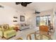 Bright living room with ceiling fans and sliding glass doors to the outdoors at 17094 Acapulco Rd # 312, Punta Gorda, FL 33955