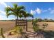 Community kayak launch sign surrounded by tropical landscaping at 17094 Acapulco Rd # 312, Punta Gorda, FL 33955