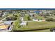 Aerial view showcasing neighborhood, nearby waterways and residential landscaping at 17408 Malarky Ln, Punta Gorda, FL 33955