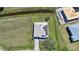 Aerial view showcasing the home's roof with solar panels and expansive surrounding landscape at 17408 Malarky Ln, Punta Gorda, FL 33955