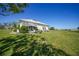 Lush backyard with patio seating, perfect for outdoor relaxation by waterway at 17408 Malarky Ln, Punta Gorda, FL 33955