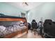 Bright bedroom featuring bunk beds and two gaming chairs at 17408 Malarky Ln, Punta Gorda, FL 33955