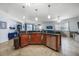 The kitchen features an island with sink and dishwasher, which opens into the living area at 17408 Malarky Ln, Punta Gorda, FL 33955