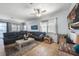 Spacious living room with a large sectional sofa, neutral color palette, and ample natural light at 17408 Malarky Ln, Punta Gorda, FL 33955