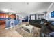 Spacious living area showcasing a modern kitchen, comfortable seating, and stylish decor at 17408 Malarky Ln, Punta Gorda, FL 33955
