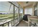 Screened porch overlooking lush backyard and scenic waterway views at 17408 Malarky Ln, Punta Gorda, FL 33955